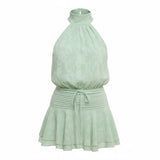 Mad-ly mint green floral chiffon halter mini dress with a smocked waist and ruffled hem.